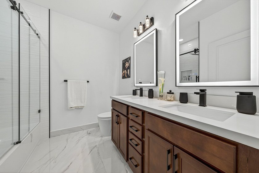 This beautifully updated 5-bedroom, 4-bath home offers the - photo 32