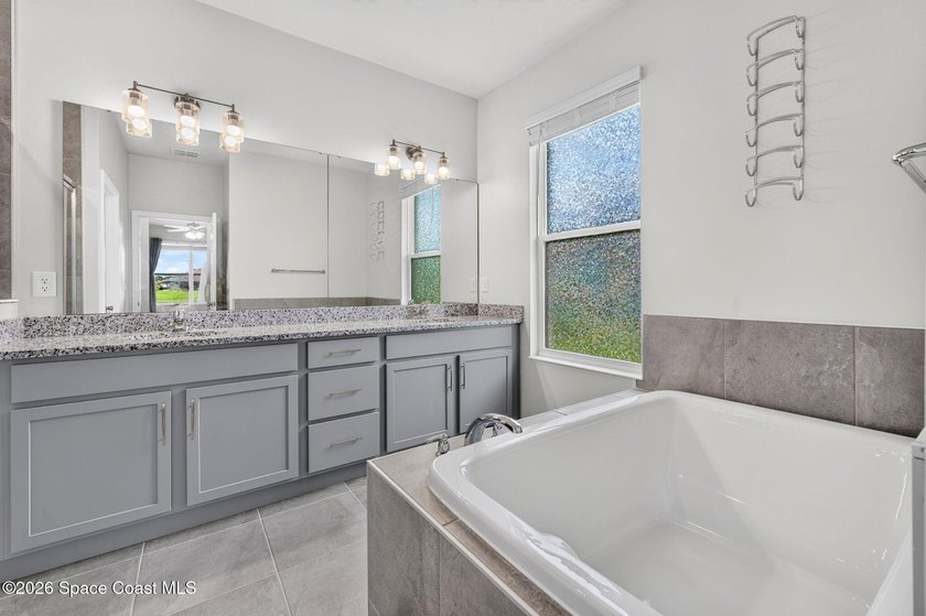 Welcome to this stunning lakefront split plan home in The - photo 9