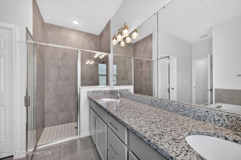 Welcome to this stunning lakefront split plan home in The - photo 10