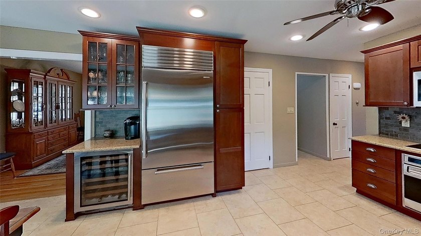 This stately residence is situated on a private street, north of - photo 12