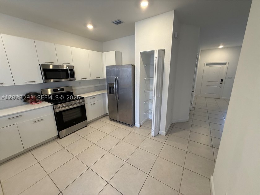 Welcome to this exceptional 4-bedroom, 2.5-bath corner-unit - photo 11