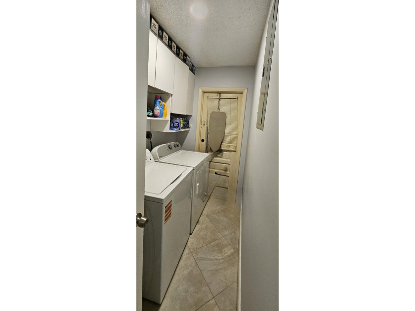 Welcome to this charming two-bedroom, two-bathroom villa in the - photo 14