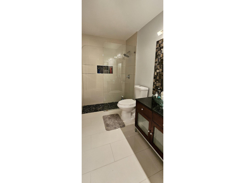 Welcome to this charming two-bedroom, two-bathroom villa in the - photo 16