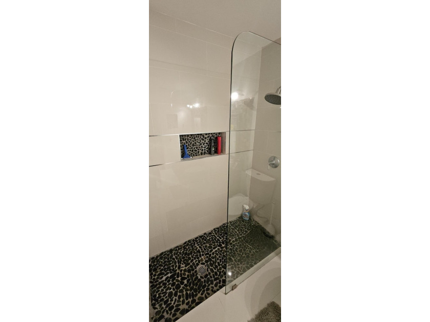 Welcome to this charming two-bedroom, two-bathroom villa in the - photo 17