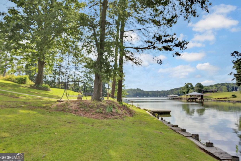 This custom-built full-time lake residence on Jackson Lake is an - photo 4