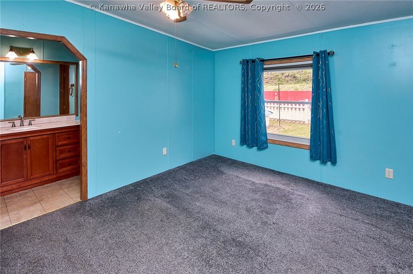 Situated on two acres in rural Milton, this 1996 double-wide - photo 5