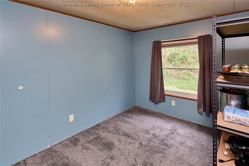 Situated on two acres in rural Milton, this 1996 double-wide - photo 9