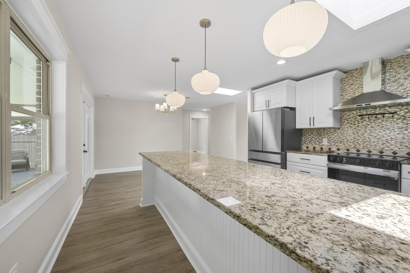 This impeccably renovated home is ready to move in! From the - photo 5