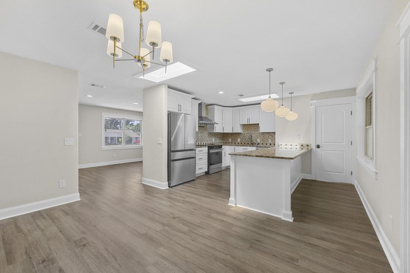 This impeccably renovated home is ready to move in! From the - photo 6