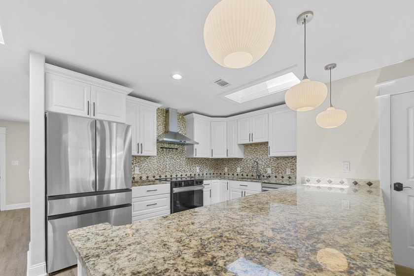 This impeccably renovated home is ready to move in! From the - photo 9