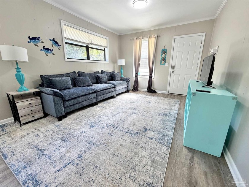 Fully renovated and move-in ready! This charming 3-bedroom - photo 2
