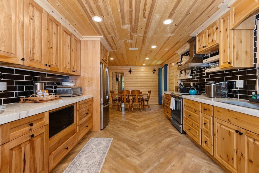 Enjoy peaceful lake living w/ 150' of frontage on private 9-acre - photo 12