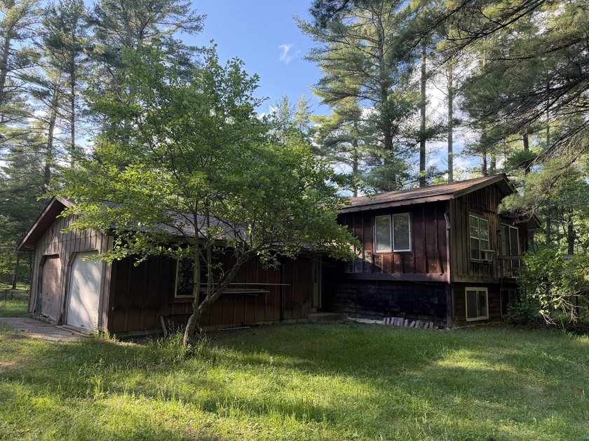 Tucked away on .68 wooded acres, this 2-bedroom 2-bath raised - photo 13
