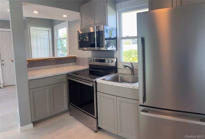 Completely newly renovated two bedroom, one bath Ranch with open - photo 11