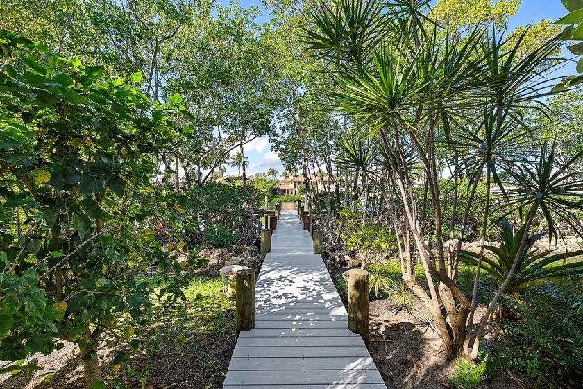 This gorgeous riverfront home boasts 100 feet of water frontage - photo 32