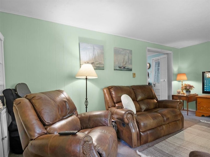 Welcome to this charming lakeside retreat tucked away on a - photo 9