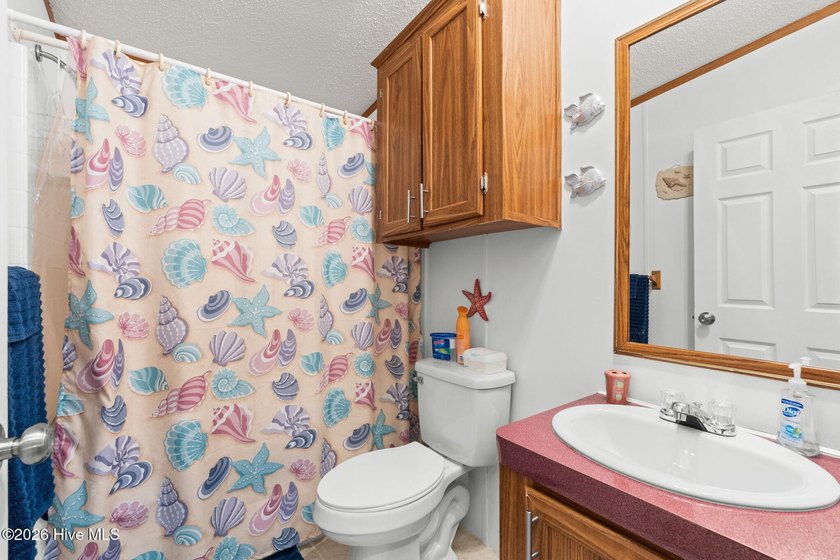 Enjoy coastal living just minutes from the sandy shores of - photo 14