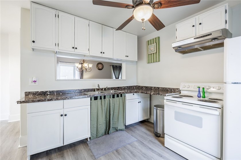 This charming home is nestled in Rochester's beloved Charlotte - photo 8