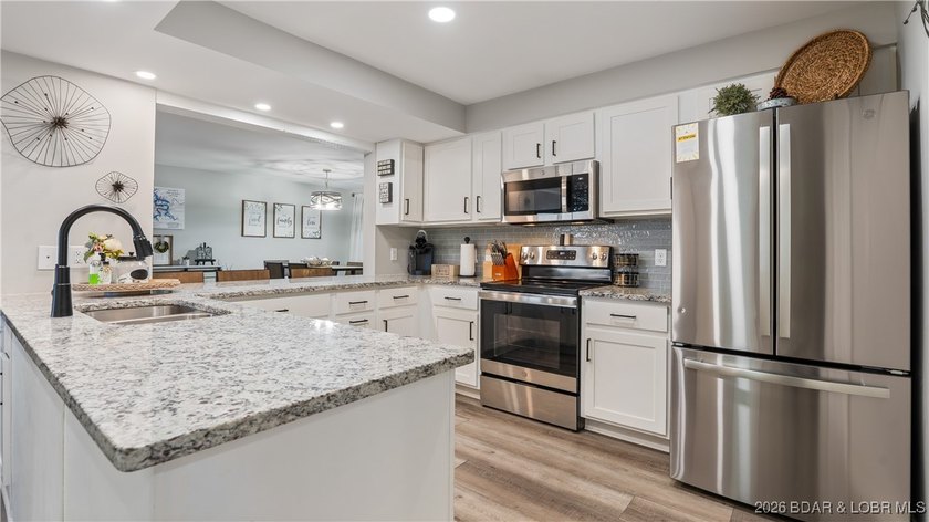 WOW-WHAT A REMODELl! Experience the difference a generous floor - photo 7