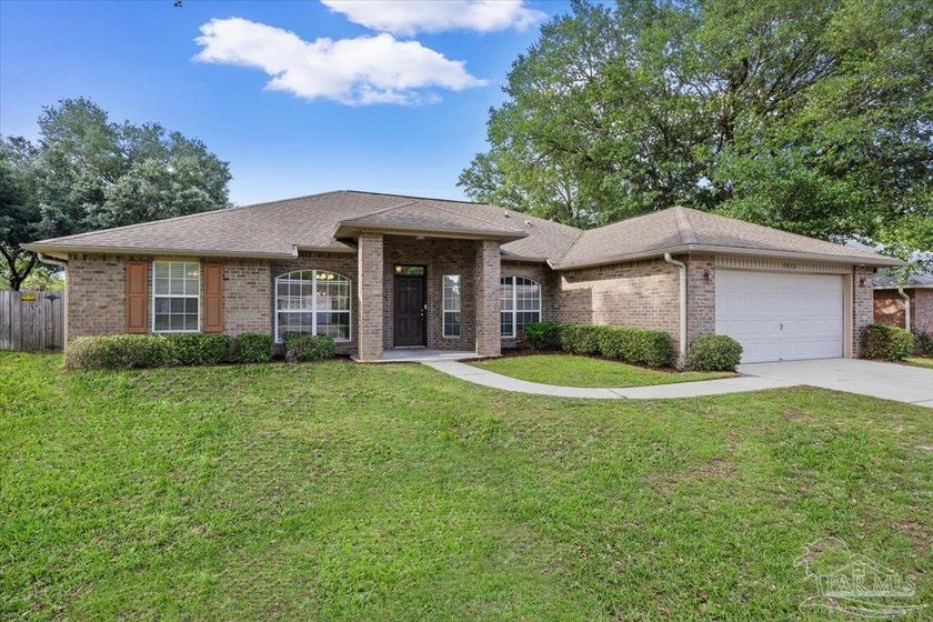Welcome to this spacious 4-bedroom, 3-bath brick home in the - photo 3