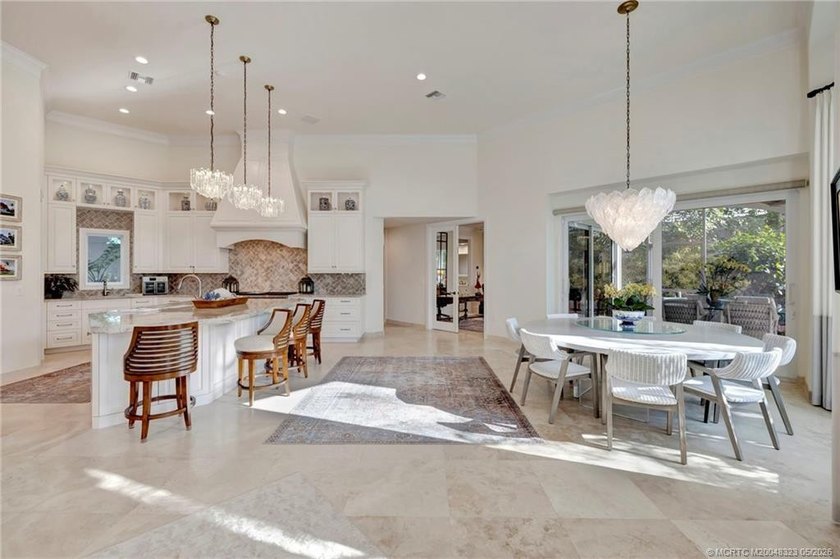 This elegant Sailfish Point estate is ideally positioned on the - photo 16