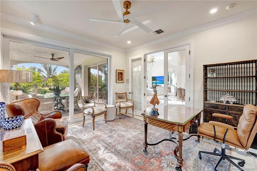 This elegant Sailfish Point estate is ideally positioned on the - photo 21