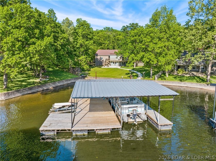 EXTREMELY MOTIVATED SELLER. Nearly flat lakefront yard, acreage - photo 2