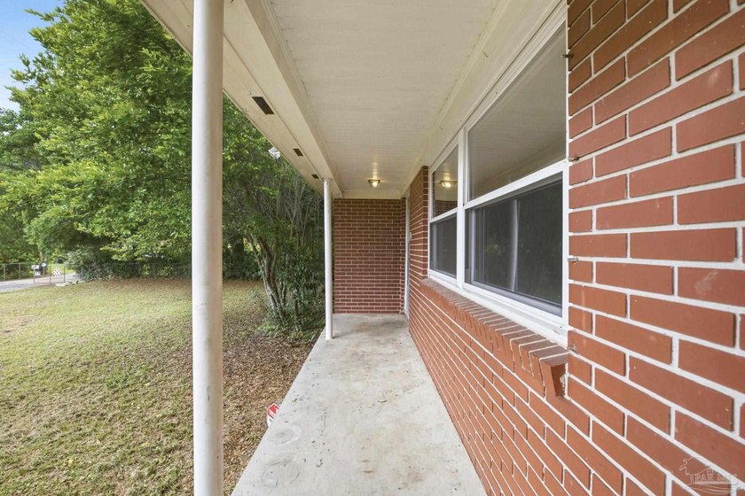 Welcome home to this charming all-brick ranch nestled on a quiet - photo 3