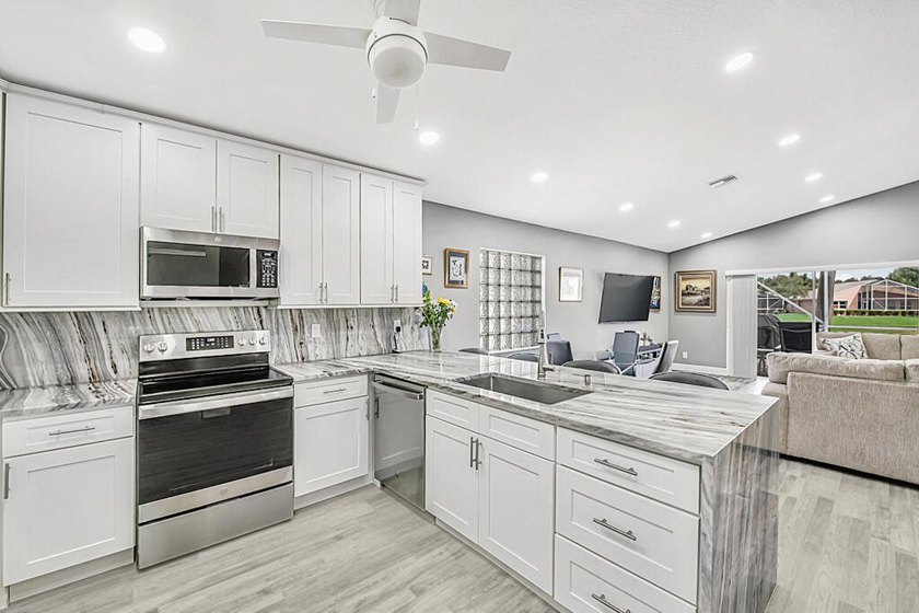 ENORMOUS GREAT ROOM! ONE OF A KIND OPEN FLOOR PLAN! LIKE NEW! - photo 17