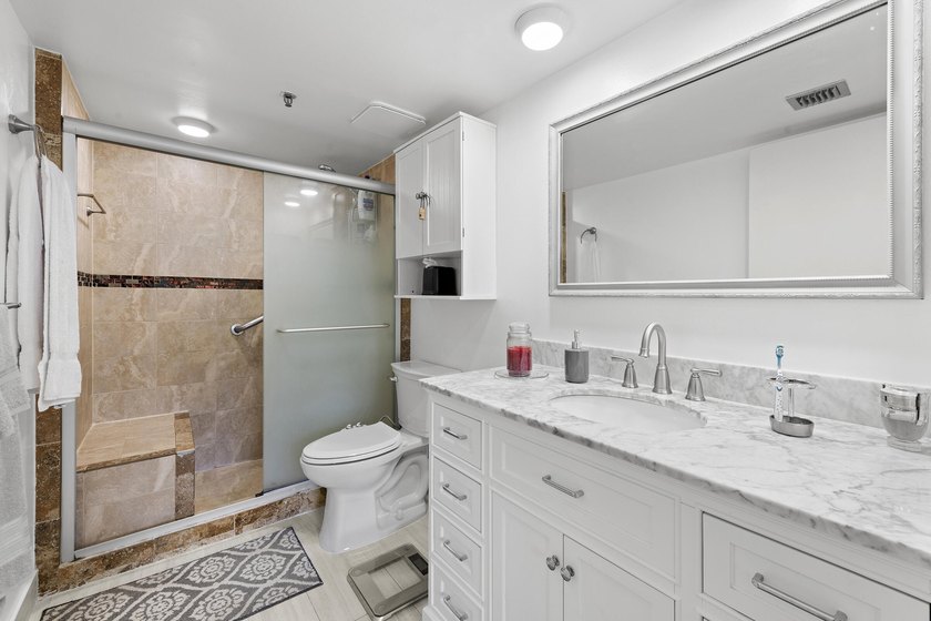 Welcome to this exceptional garden apartment, a rare find with - photo 13