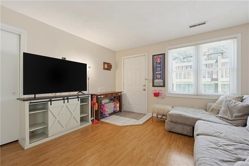 Enjoy the ease of one-level living in this desirable end-unit - photo 17