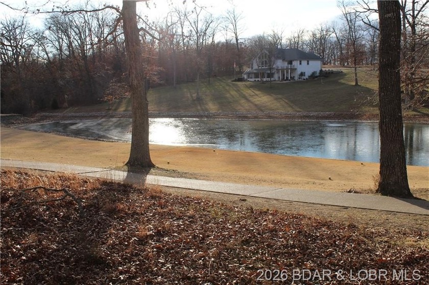 Discover this ready-to-build lot overlooking a peaceful pond - photo 5
