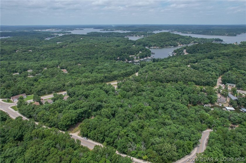 1.62-acre wooded lot in the sought-after Four Seasons community - photo 17