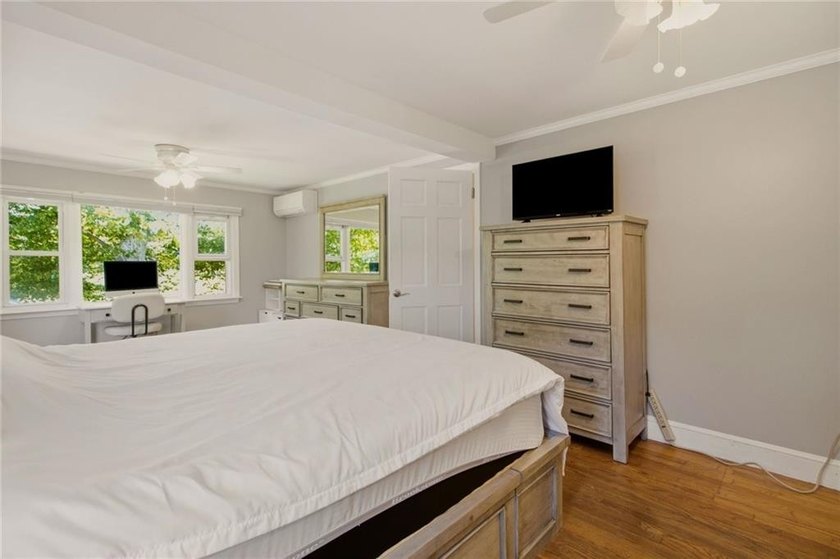 Tucked away on a quiet street and backing directly onto the open - photo 21