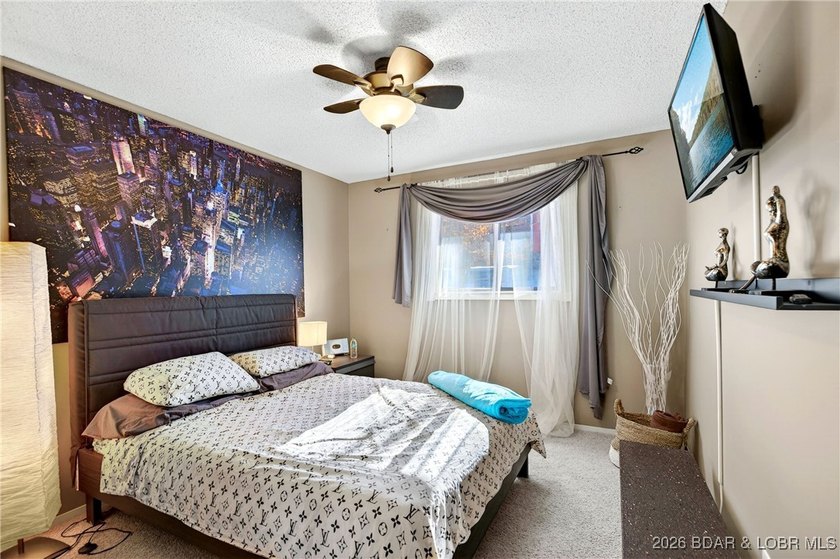 Lake life doesn't get easier-or cozier-than this. This two-story - photo 10