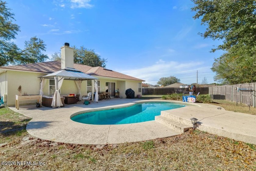 A home with a backyard and in-ground pool on a cul de sac. Check - photo 17