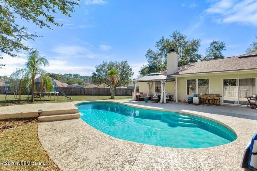 A home with a backyard and in-ground pool on a cul de sac. Check - photo 18