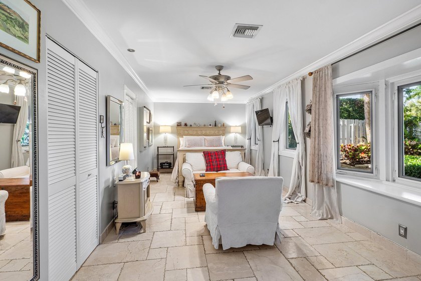 Tucked behind an arched gate on one of Palm Trail's most coveted - photo 27