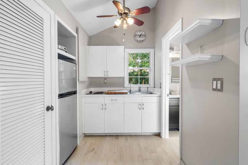 Tucked behind an arched gate on one of Palm Trail's most coveted - photo 40