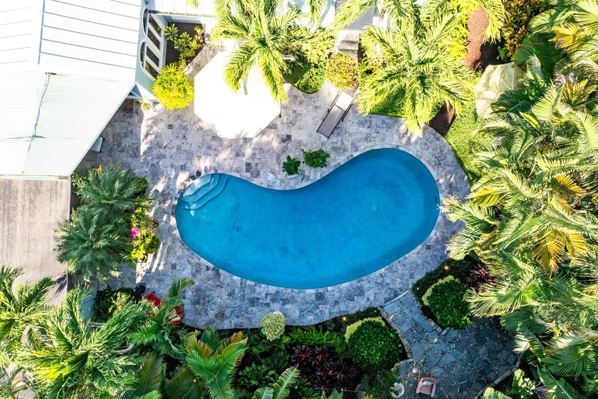 Tucked behind an arched gate on one of Palm Trail's most coveted - photo 49