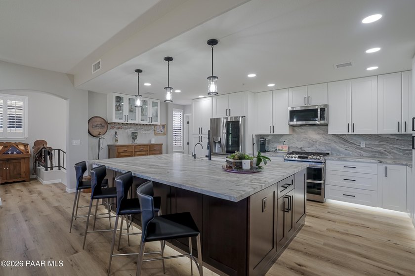 Experience elevated, low-maintenance living in the prestigious - photo 4