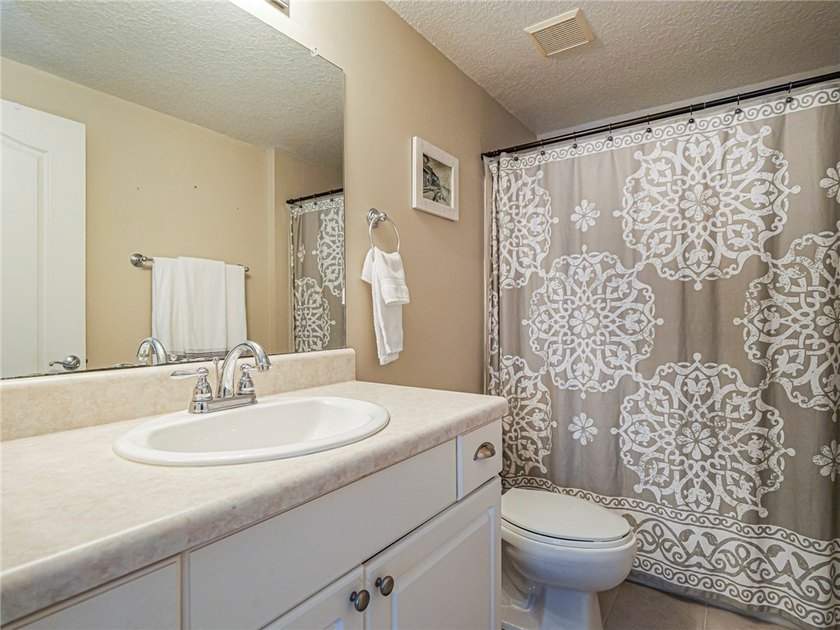Charming top-floor condo nestled among the treetops! Bright + - photo 22