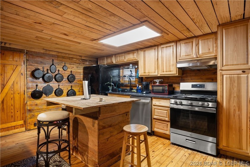 Escape to this adorable 2-bed, 2-bath rustic log cabin tucked - photo 9