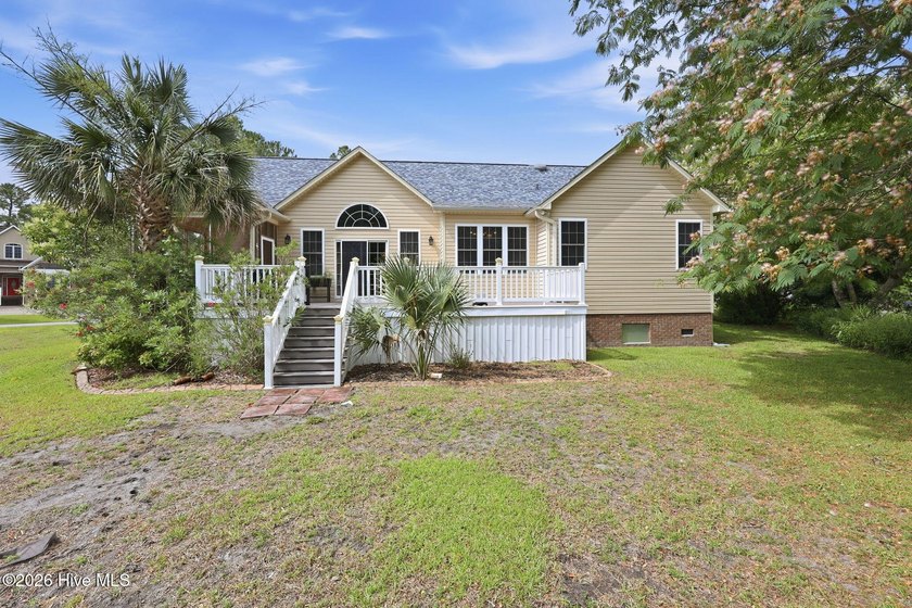 Discover refined coastal living in this beautifully maintained - photo 2