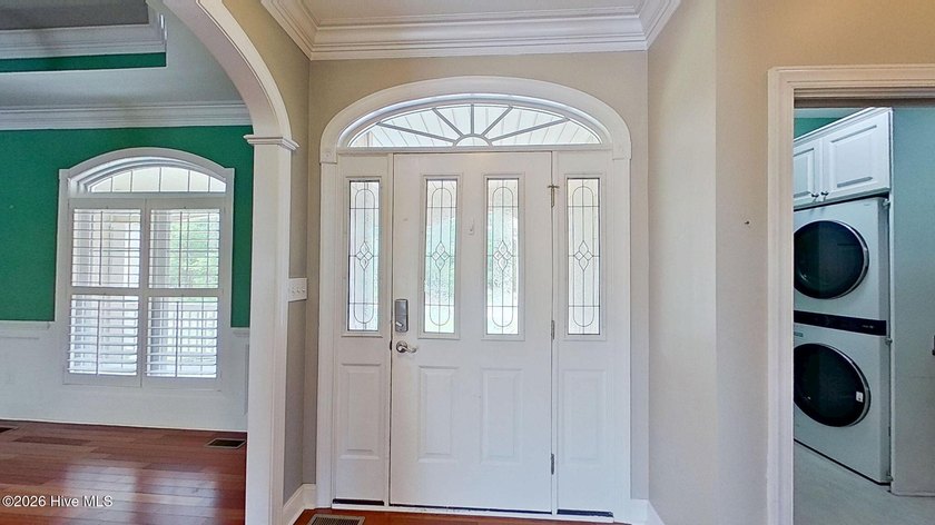 Discover refined coastal living in this beautifully maintained - photo 5