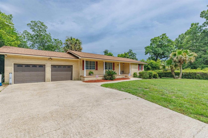 Welcome home to 902 N 75th Avenue, a charming property that - photo 4