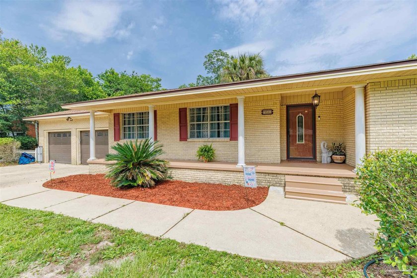 Welcome home to 902 N 75th Avenue, a charming property that - photo 5