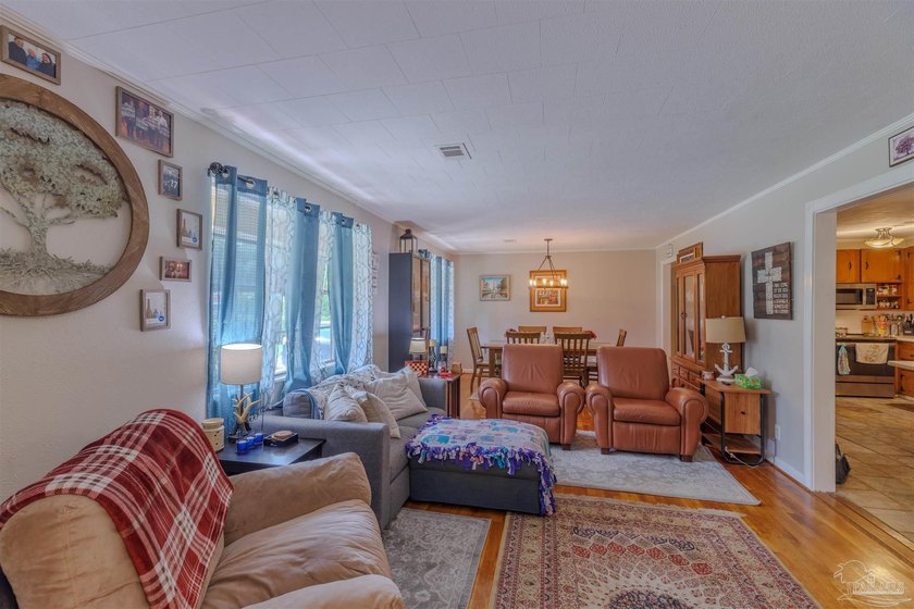 Welcome home to 902 N 75th Avenue, a charming property that - photo 7