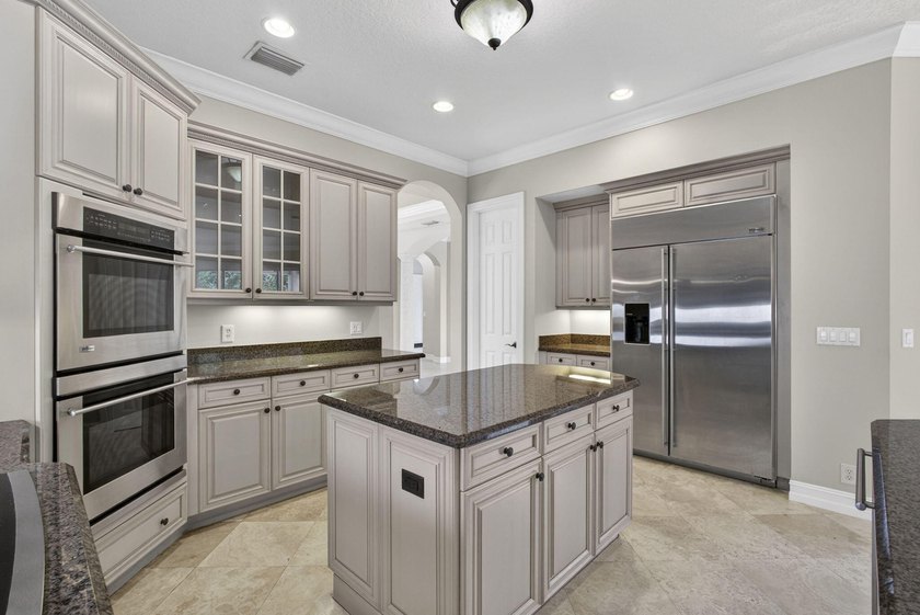 Located on a private cul-de-sac lakefront lot in the exclusive - photo 14
