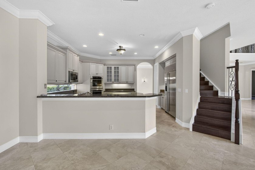 Located on a private cul-de-sac lakefront lot in the exclusive - photo 16
